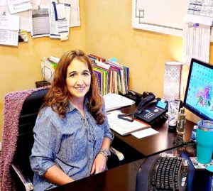 Dawn Stich Sitting at Desk