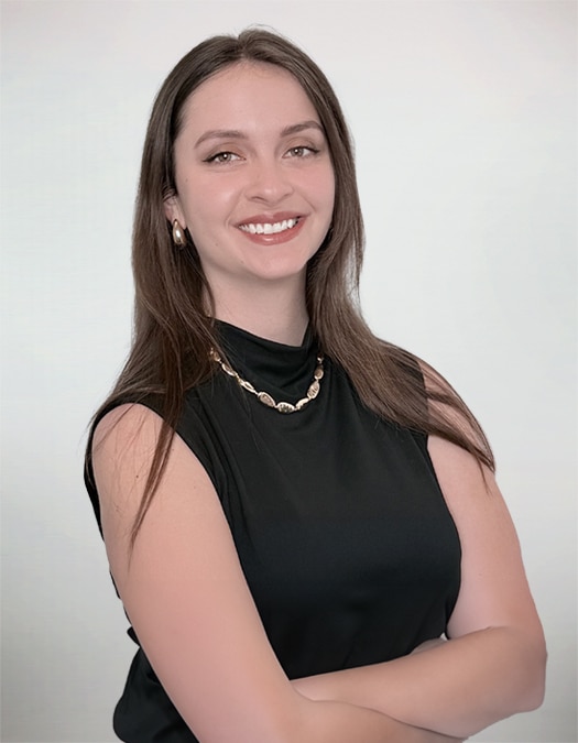 Smiling person with long hair and black attire
